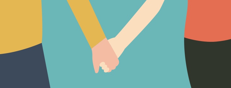 Man and woman holding hands intimately
