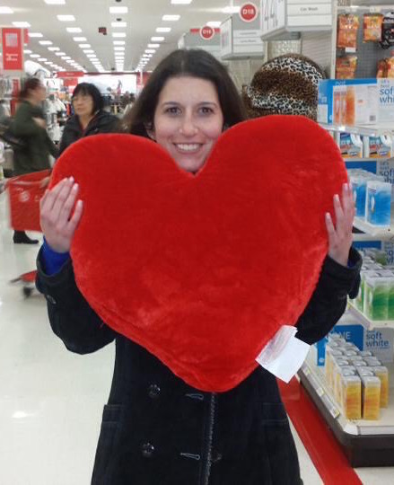 Woman with ulcerative colitis holding stuffed heart