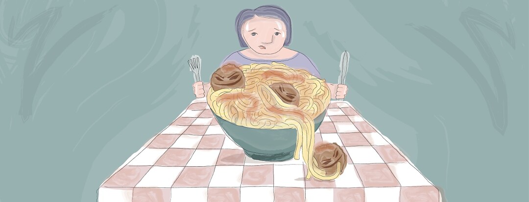 A woman sweating while staring at a big bowl of spaghetti and meatballs.