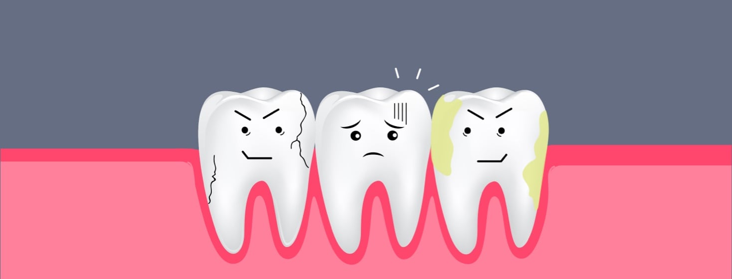 A group of three distraught and decaying teeth.