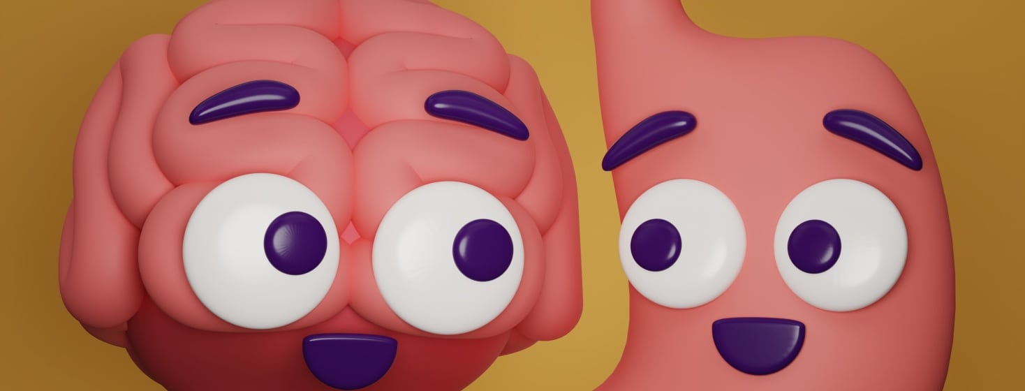 A humanized, wide-eyed, and smiling brain and stomach are looking at each other.