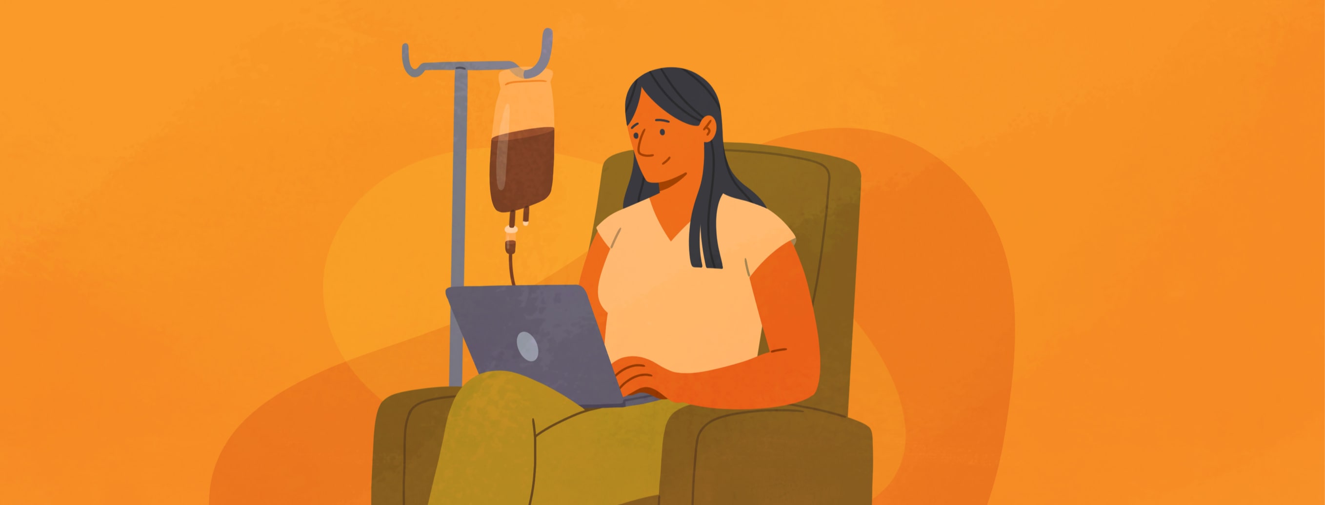 An adult woman receiving an iron infusion while happily working away on a laptop