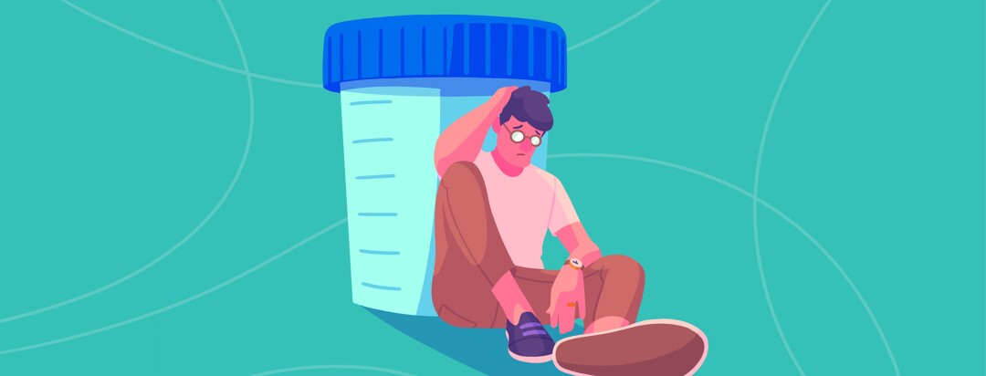 A disheartened man sits slumped against a sample cup