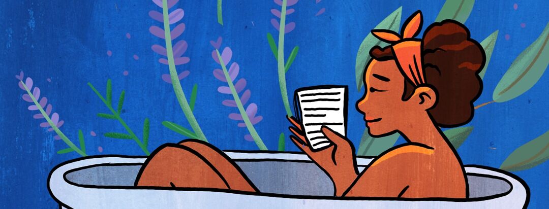 A woman relaxes in an epson salt sitz bath while relaxing and reading a book.